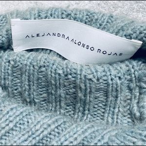 Blue cashmere sweater by Alejandra Alonso Rojas.